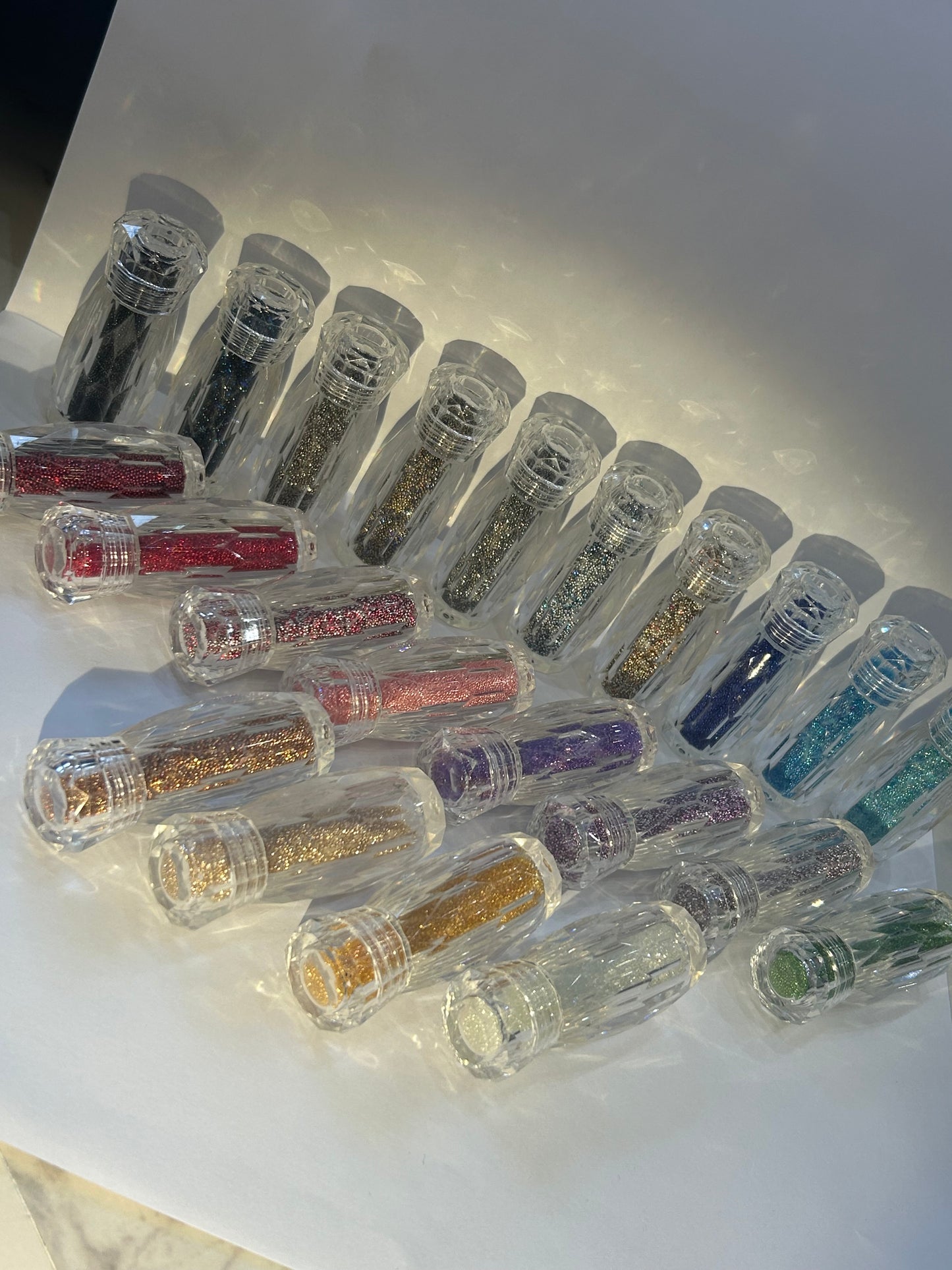 Micro caviar pixie crystals in clear bottles