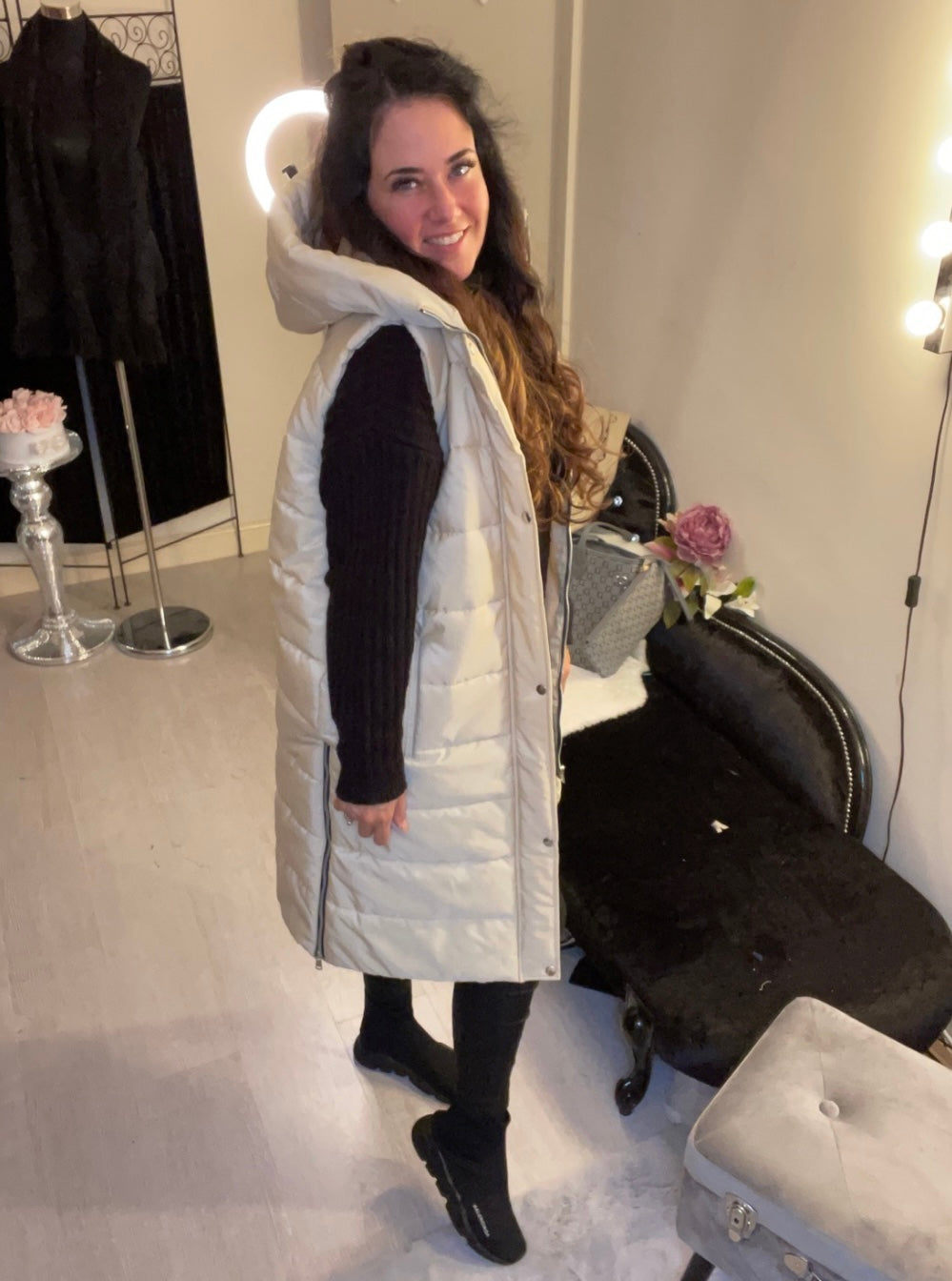 Cream long line body warmer with side zips for walking and a hood