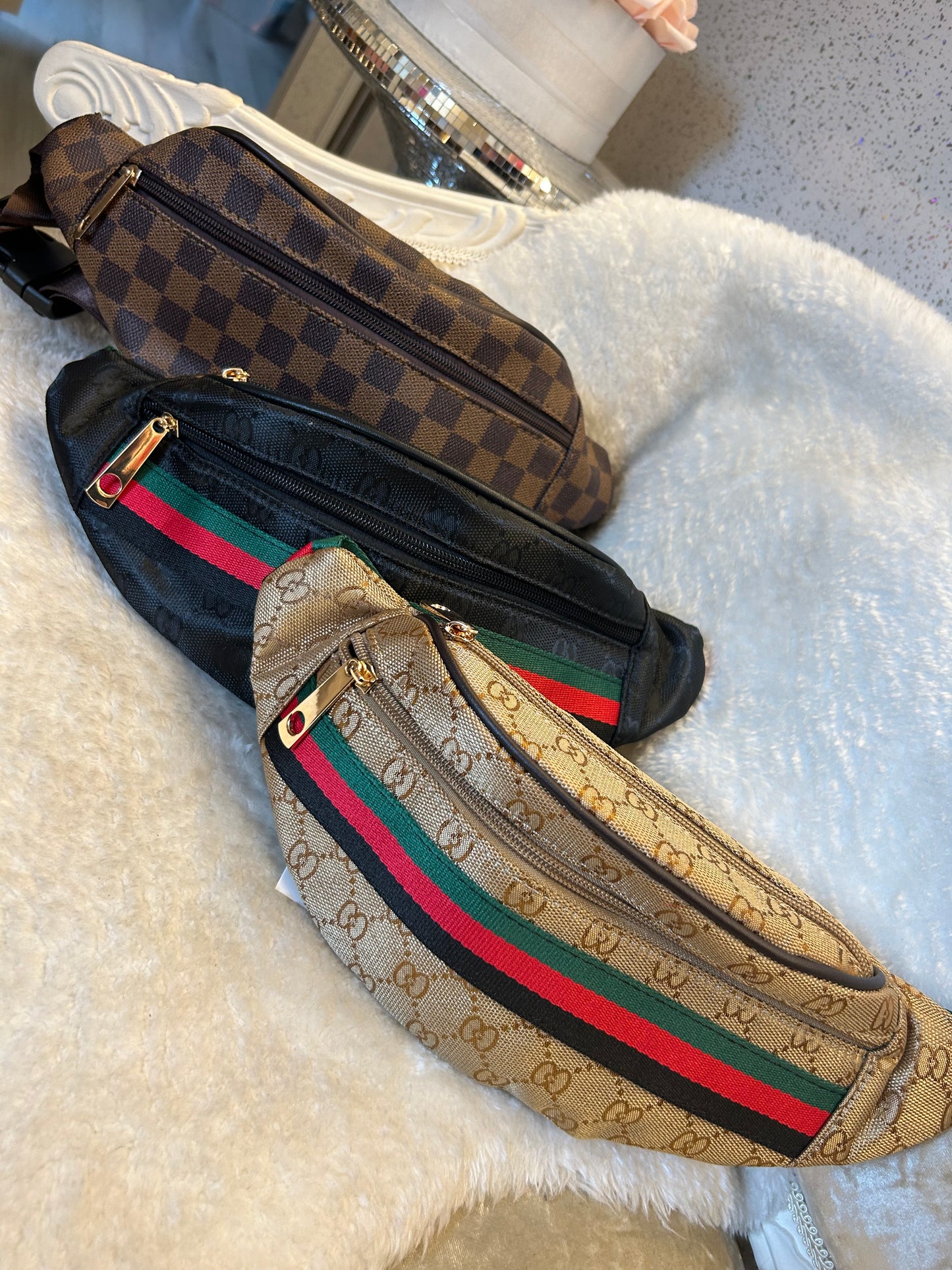 Brown buckle fastening bum bags
