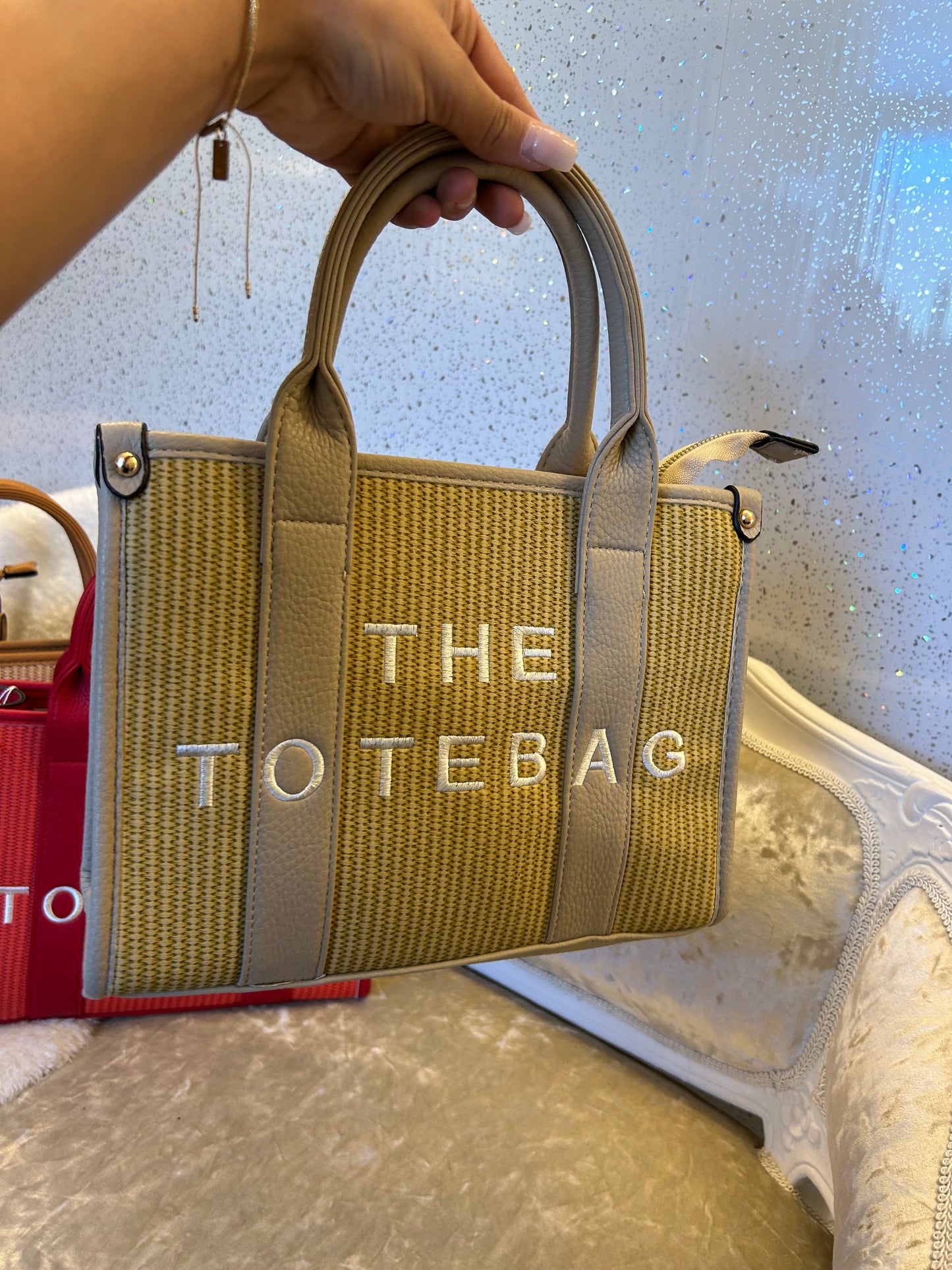 Beige tote bag with 'THE TOTE BAG' text