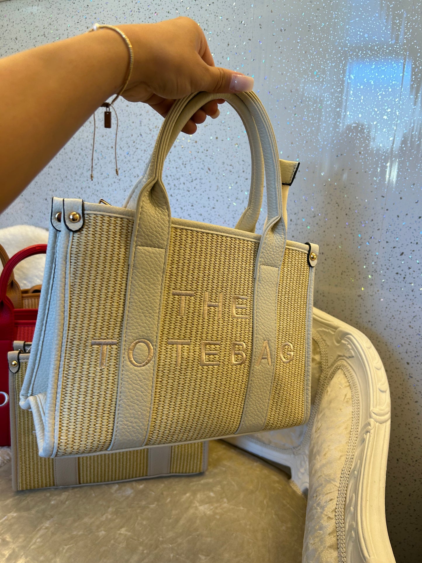 Beige woven with 'the tote bag” text