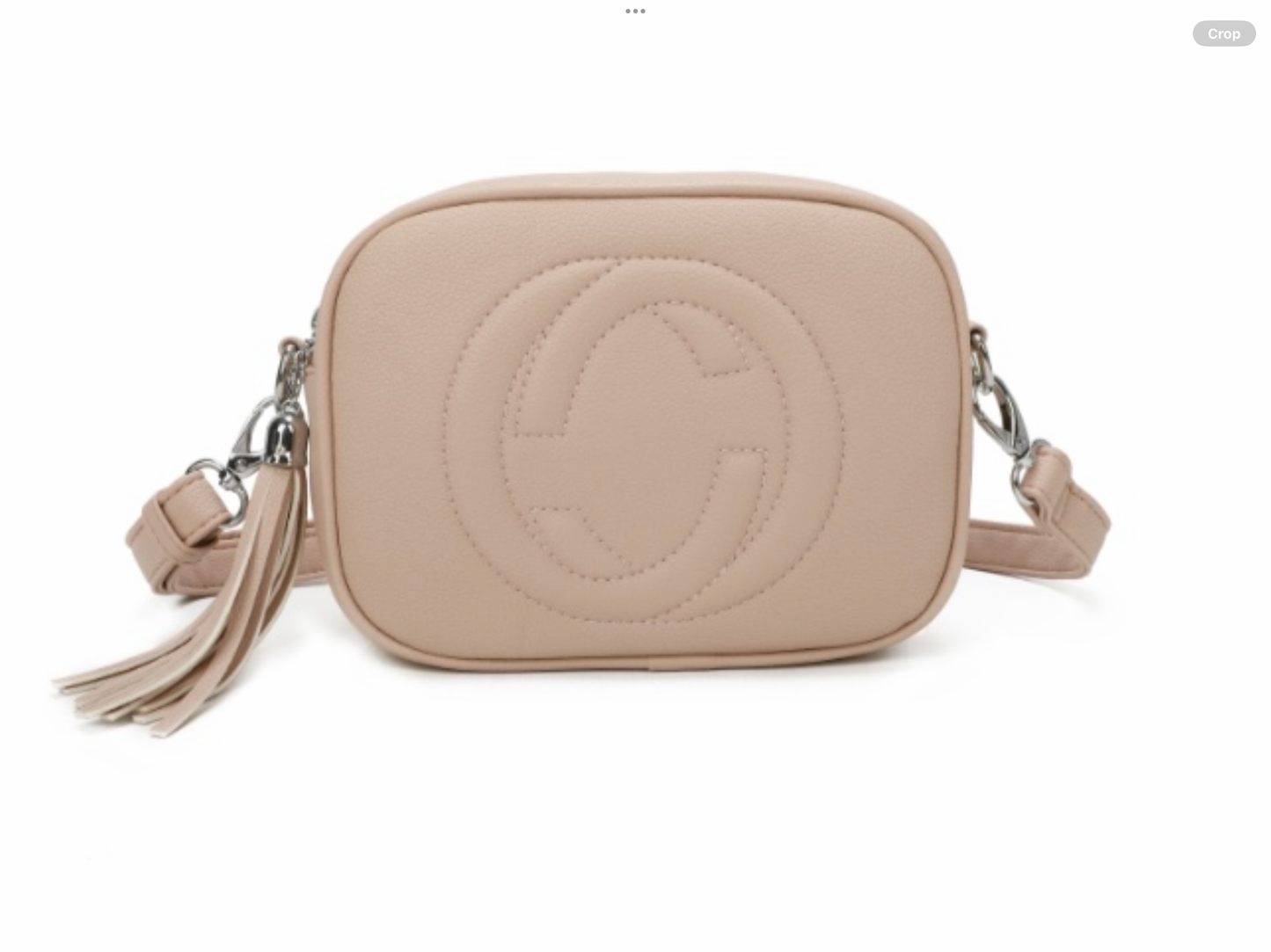 Cross body bag with tassel and stitched print