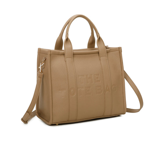 A beige tote bag with embossed ‘The Tote Bag’ text, structured design with top handles and detachable shoulder strap