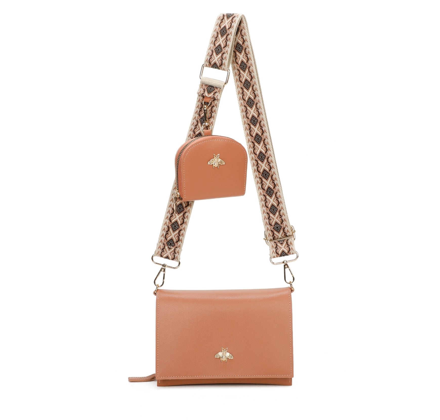 Brown leather crossbody bag with a patterned strap on a white background