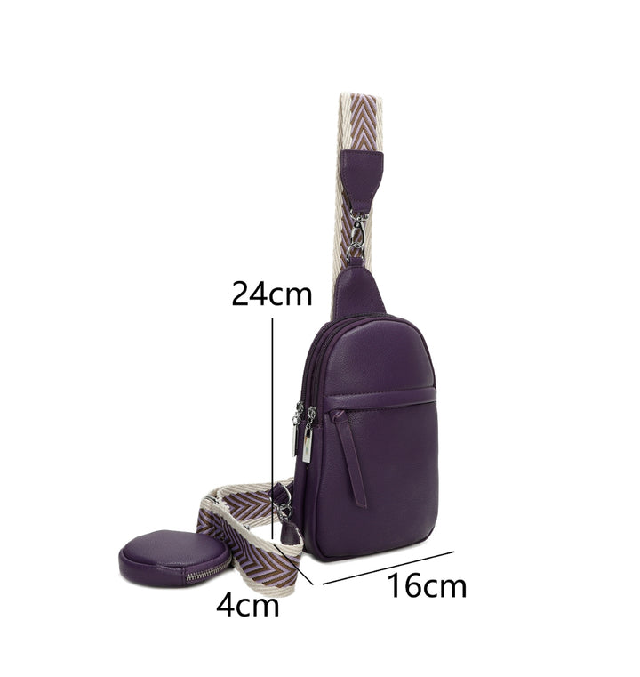Purple faux-leather crossbody bag with a chevron-patterned strap and small detachable coin pouch.