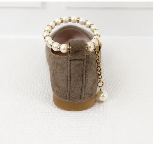 Girls taupe ballet flat shoes with pearl ankle bracelet strap, gold charm detail and soft suede-effect finish.