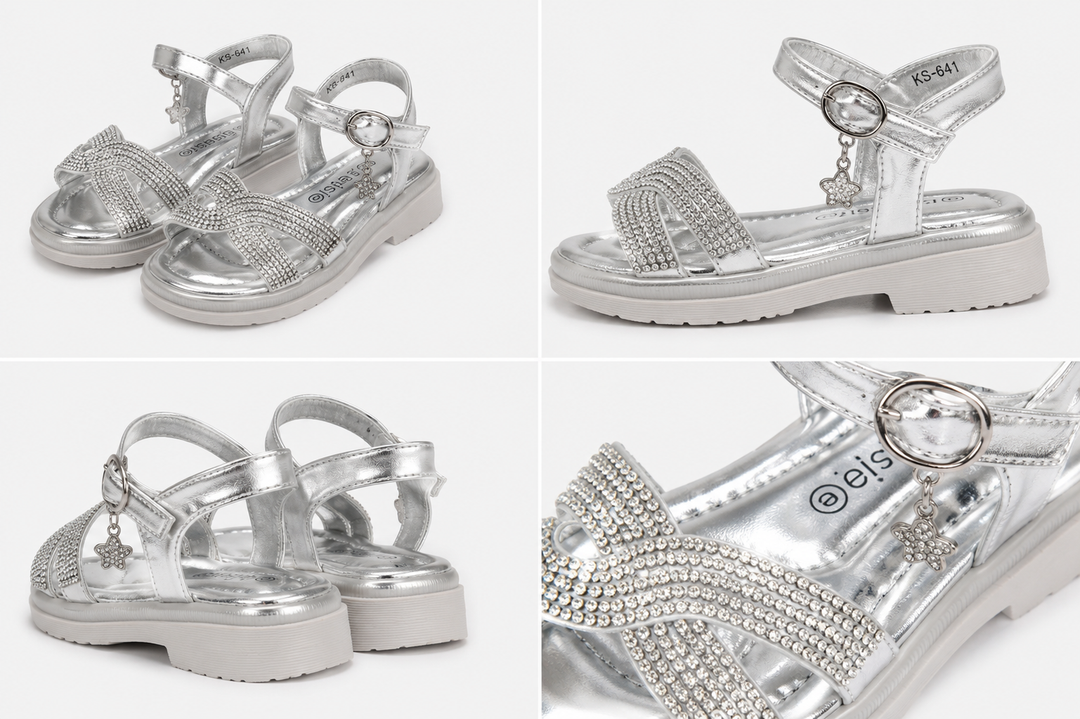 Girls silver diamante sandals with sparkling crossover straps, metallic silver finish and a dangling crystal clover charm
