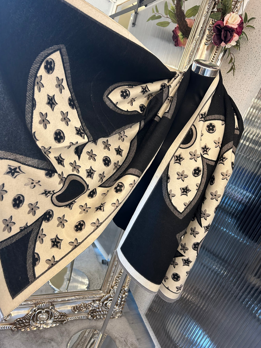 Oversized XL scarf with bold flower print design, displayed as a women’s fashion accessory.
