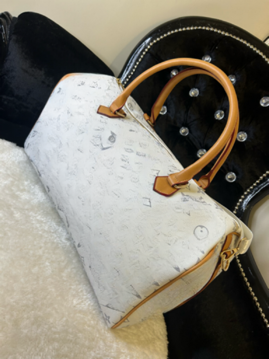 white holdall with inspired print prints on the whole of the bag 