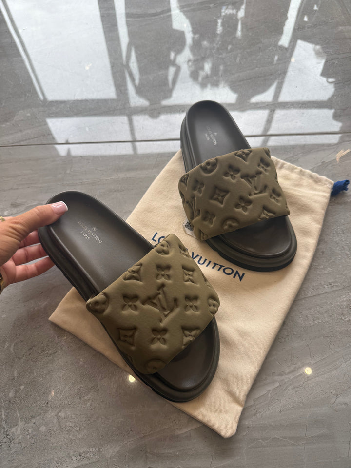 Khaki padded embossed platform sliders with cushioned footbed and chunky sole.