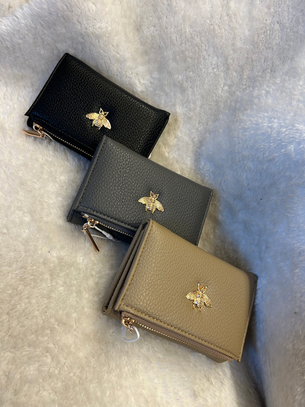 Sleeve purse detailed with gold bee 