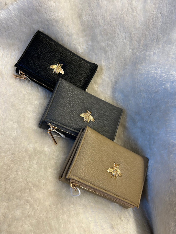 Sleeve purse detailed with gold bee 