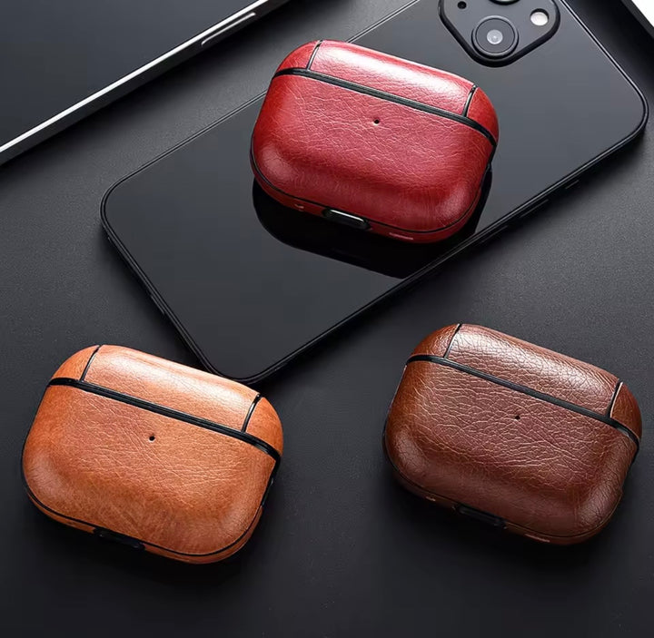 Three brown AirPod cases