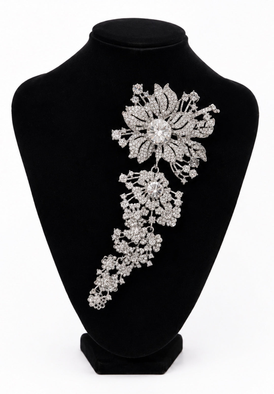 Silver crystal cascading floral statement brooch with large flower and sparkling drop detail