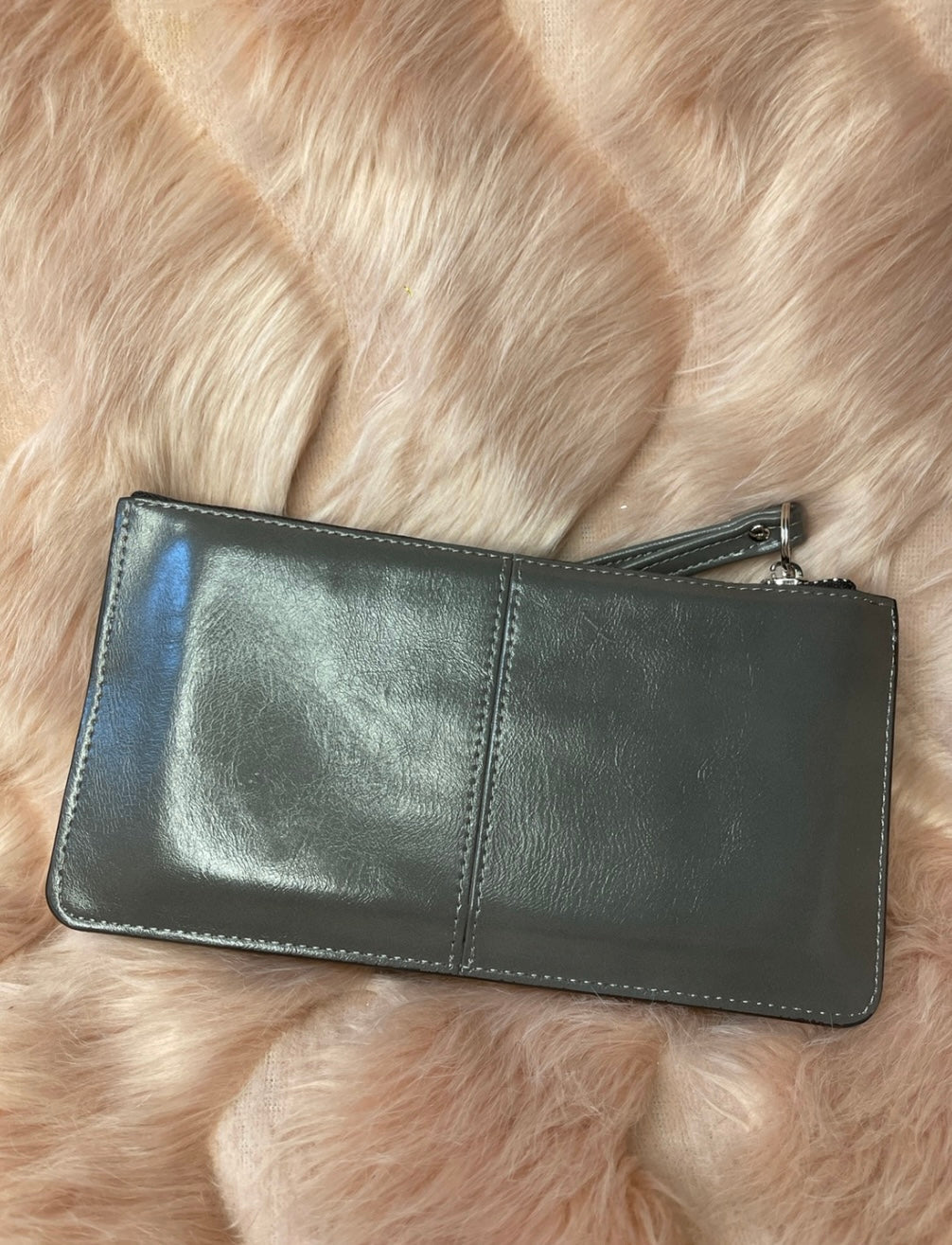 A grey expandable silver detail purse 