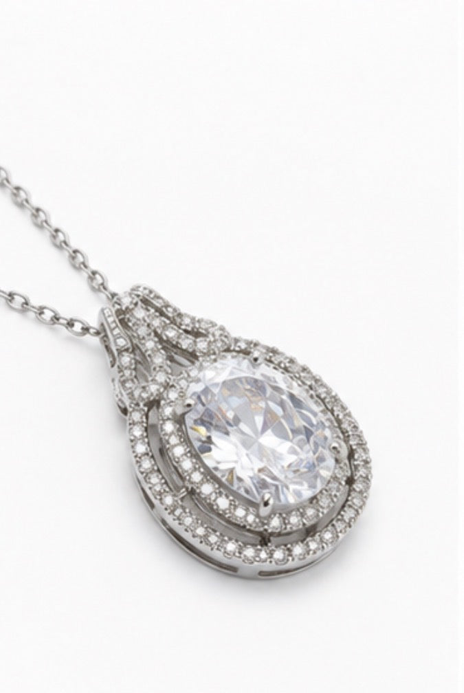 Silver teardrop crystal pendant necklace with halo detailing and adjustable chain 