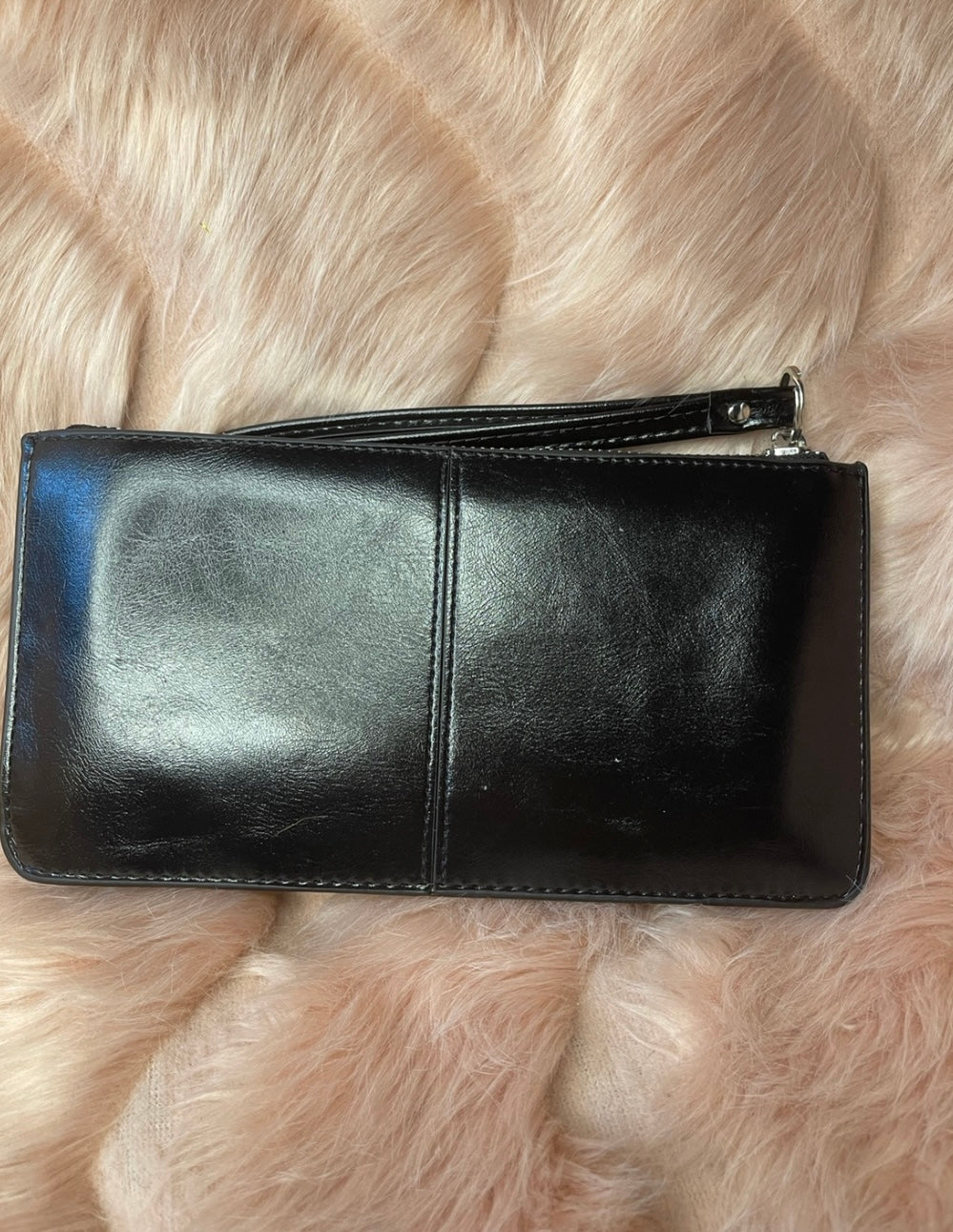 A black expandable silver detail purse 
