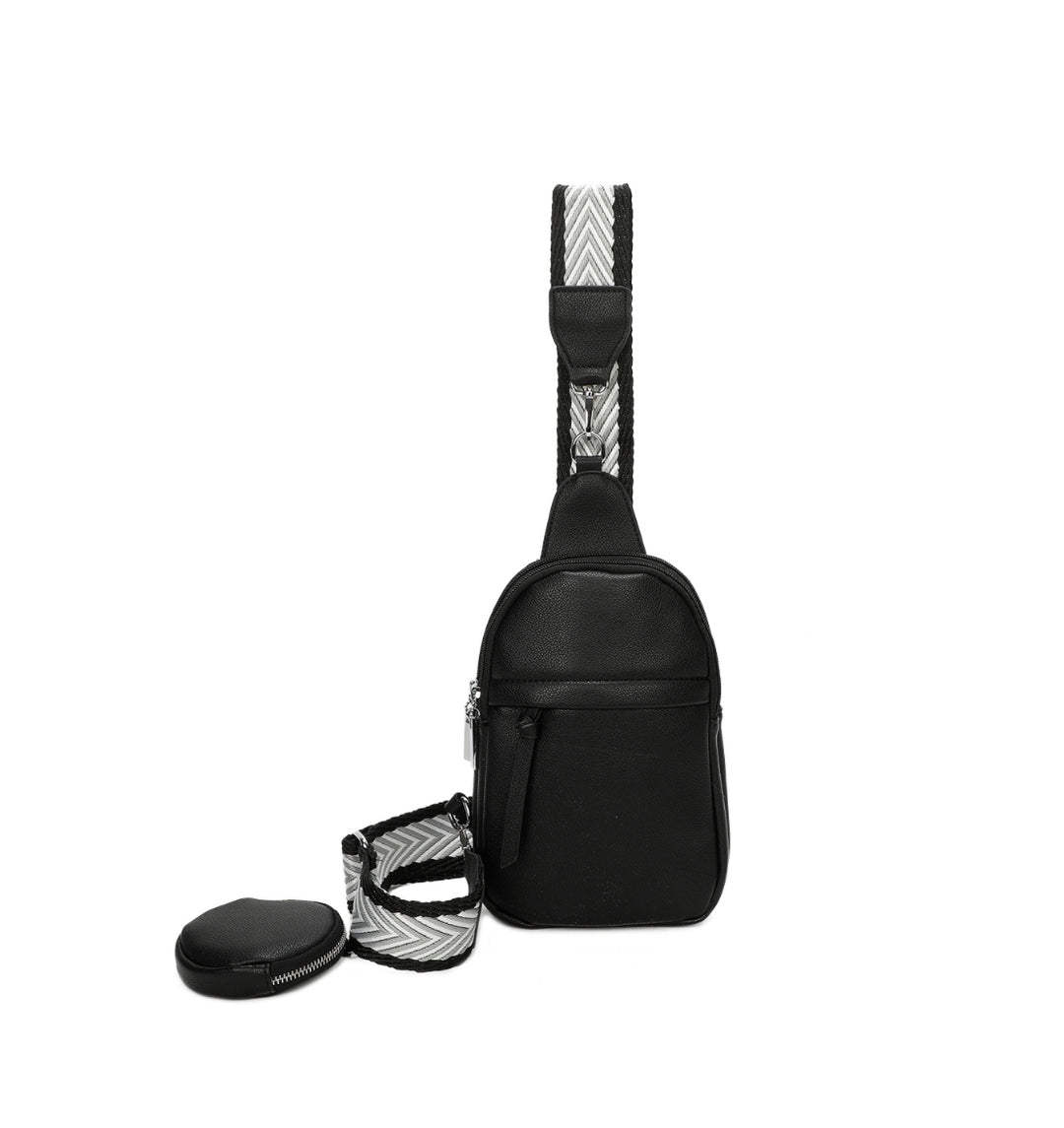 Black faux-leather crossbody bag with a chevron-patterned strap and small detachable coin pouch.