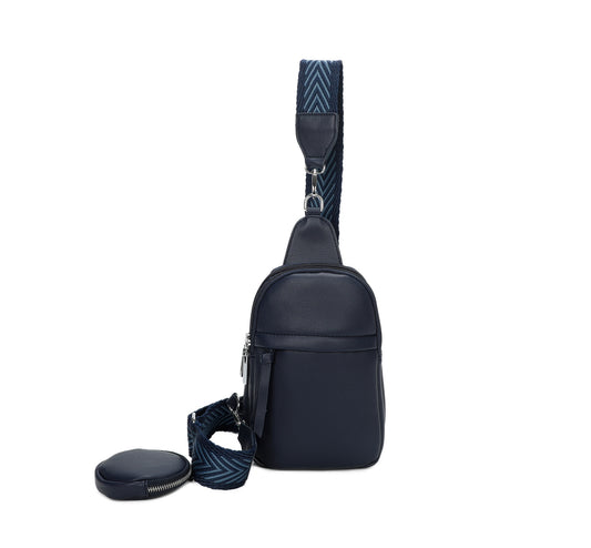 Navy faux-leather crossbody bag with a chevron-patterned strap and small detachable coin pouch.