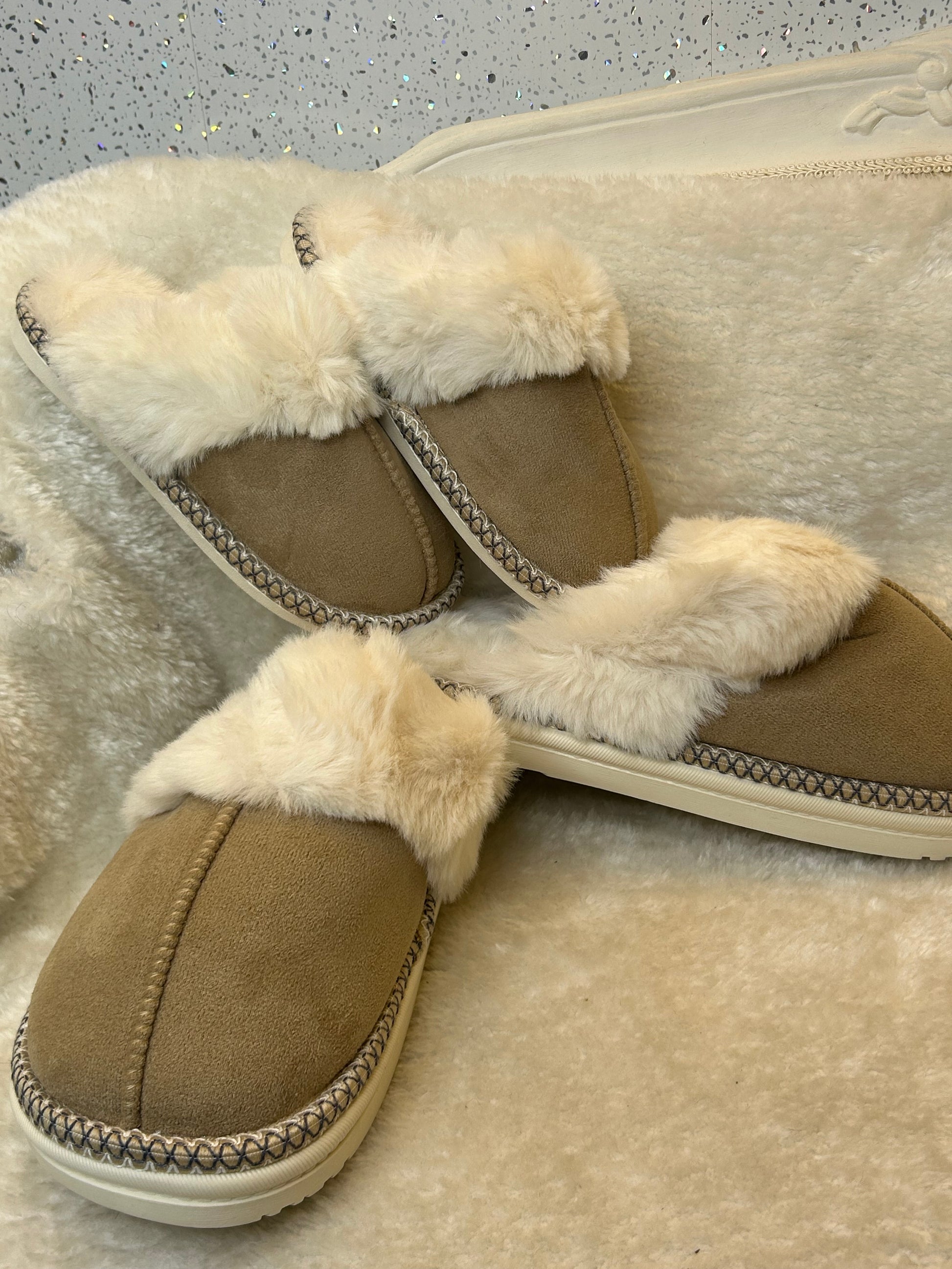 Beige fur lined slip on slippers with stitching detail 