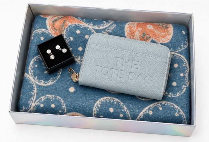 Luxury gift bundle collection featuring four coordinated sets with soft patterned scarves, matching purses, wallets and elegant earrings, beautifully presented in gift boxes.