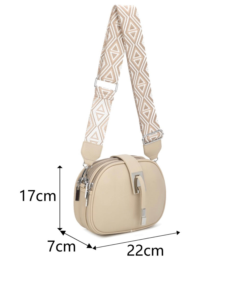 Beige handbag with a patterned strap, shown with dimensions