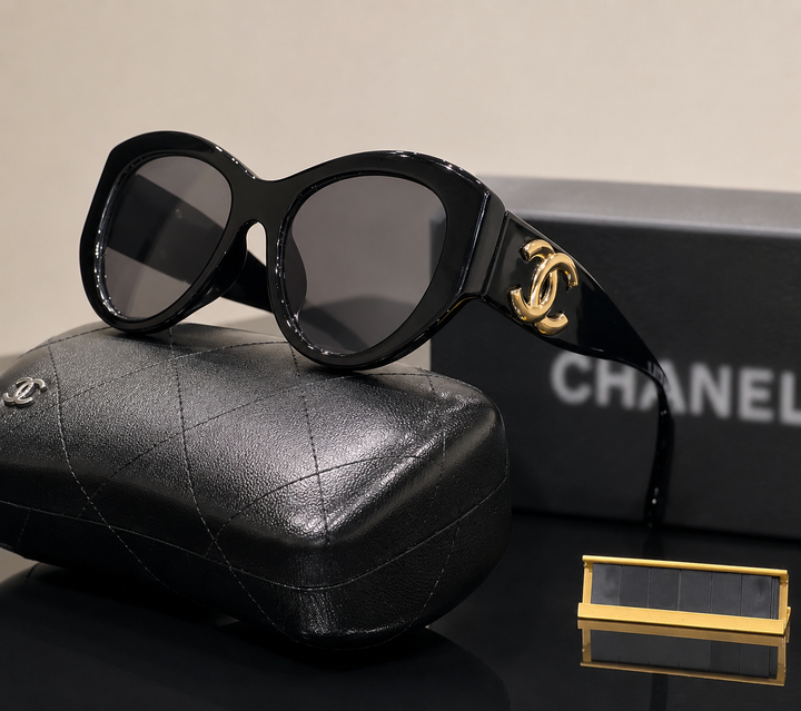 Black sunglasses with gold detail 