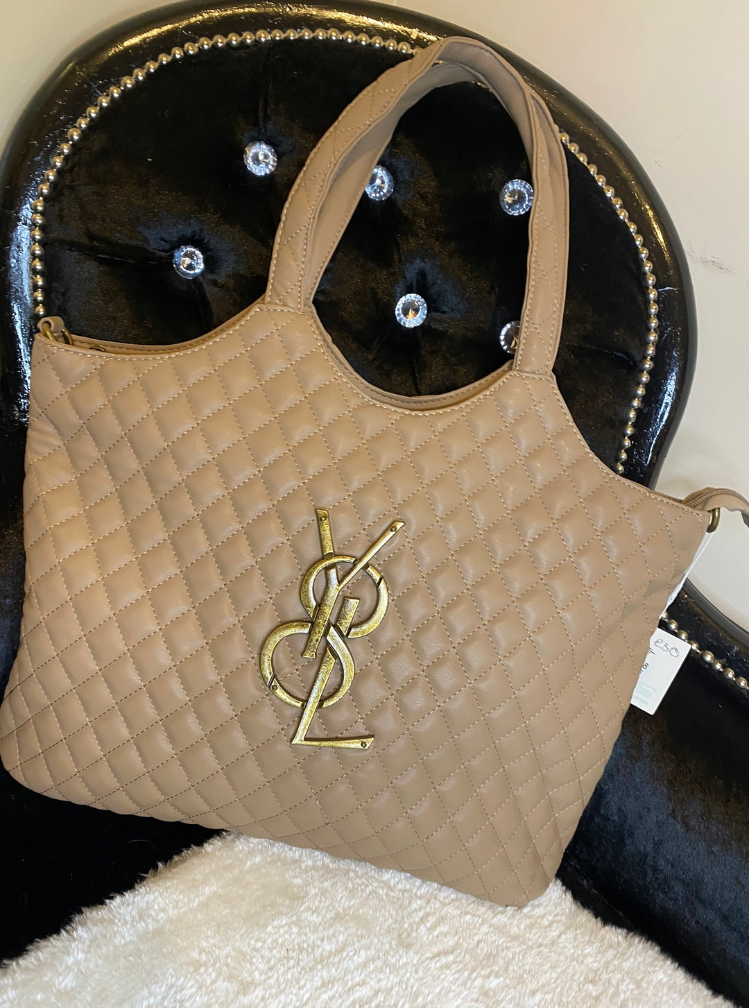 Beige large size quilted bag with gold detailed hardware and long adjustable removable strap