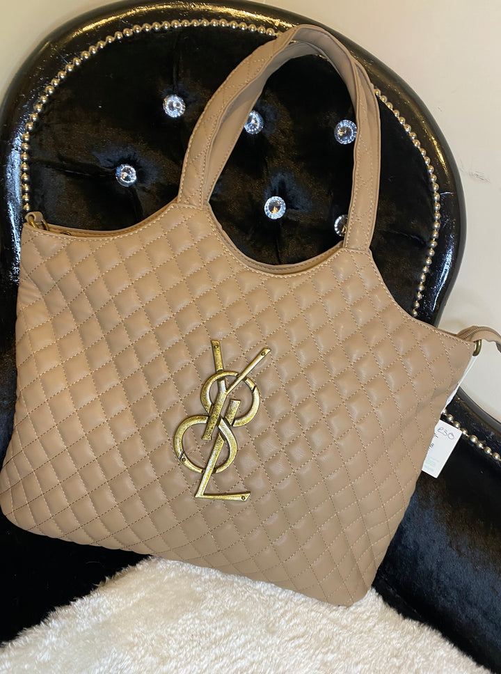 Beige large size quilted bag with gold detailed hardware and long adjustable removable strap