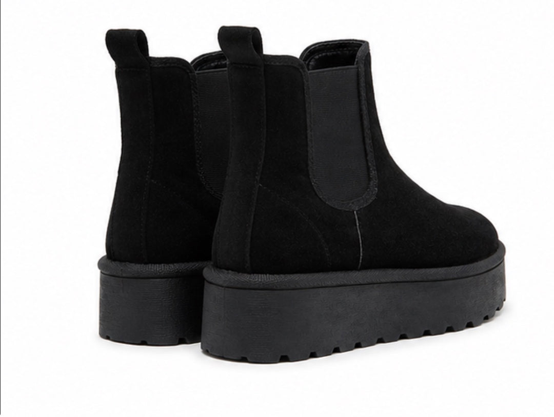 Black suede chunky platform Chelsea ankle boots with elastic side panels and thick ridged sole
