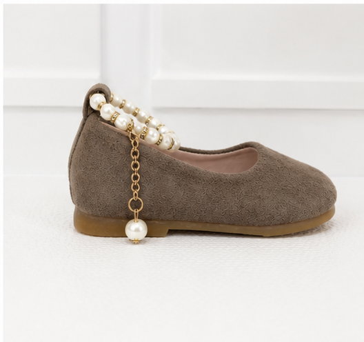 Girls taupe ballet flat shoes with pearl ankle bracelet strap, gold charm detail and soft suede-effect finish.