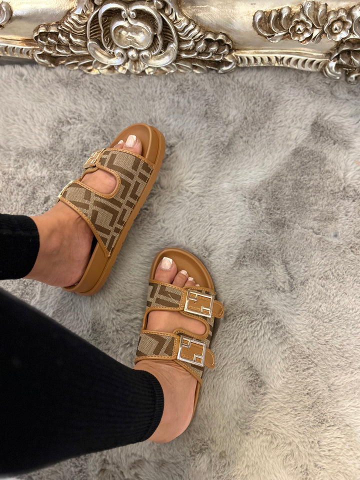 Brown patterned sliders with gold buckle detail