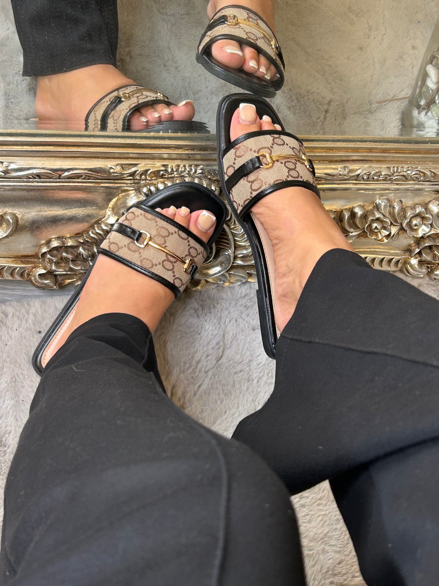 Beige and black sliders with chain detail