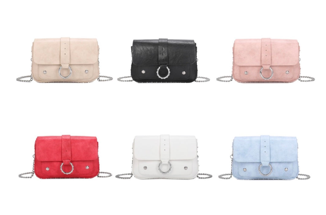 faux leather crossbody bag with silver chain strap and statement ring detail fastening.