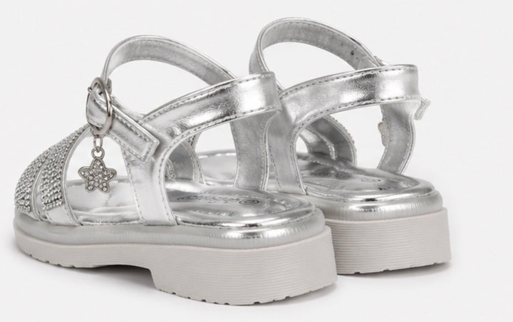 Girls silver diamante sandals with sparkling crossover straps, metallic silver finish and a dangling crystal clover charm