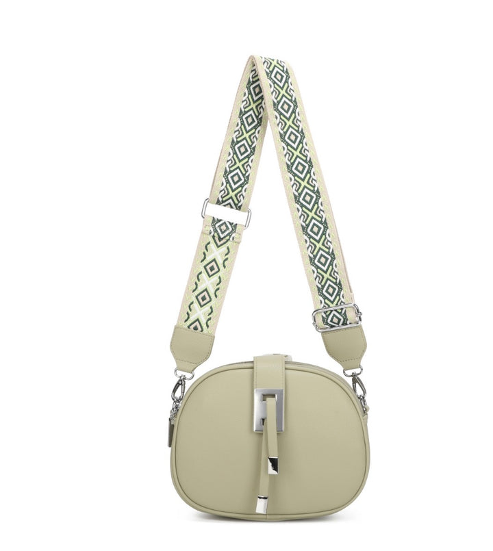 Light green handbag with a patterned strap