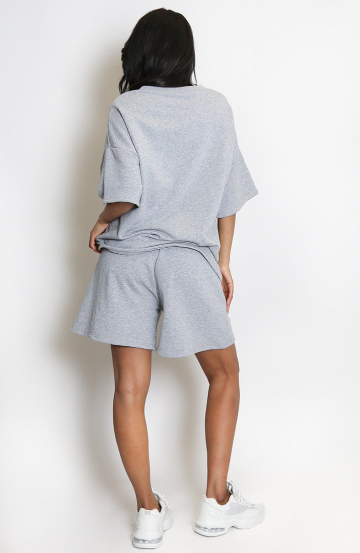  a grey outfit with shorts and a T-shirt 