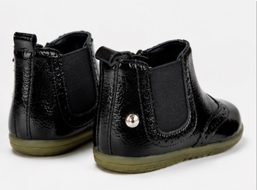 Children’s black patent ankle boots with textured finish, zip fastening and chunky sole