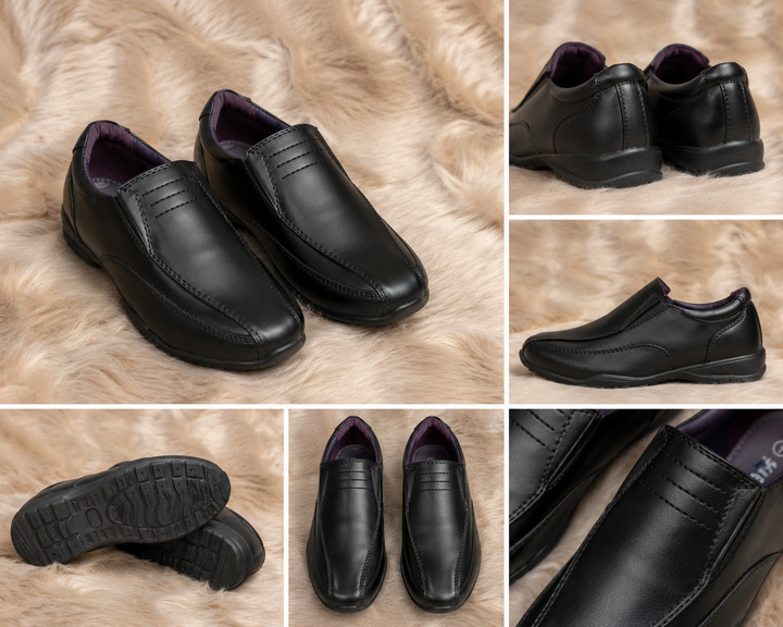 Boys black smart shoes with smooth leather-look finish and comfortable low wedge sole.