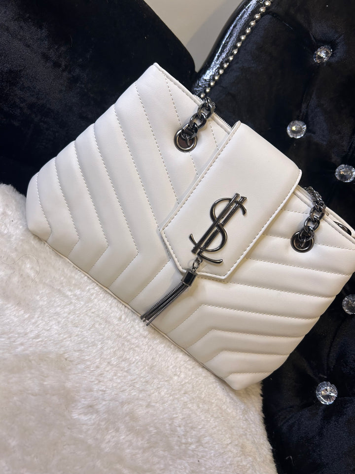 White quilted medium size handbag with metal hardware, chain straps and flap closure