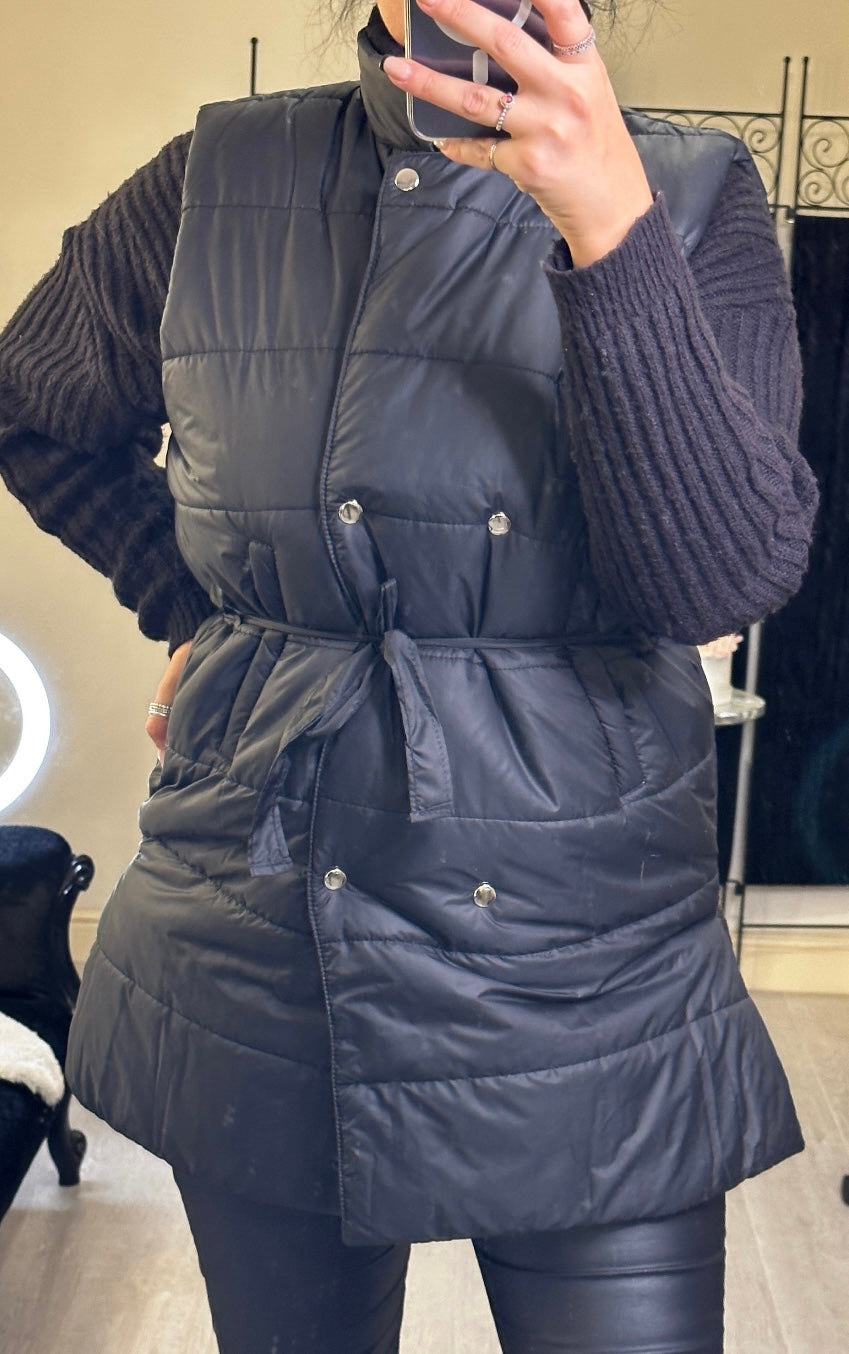  Mid-length gilet, in black with ribbon around waist