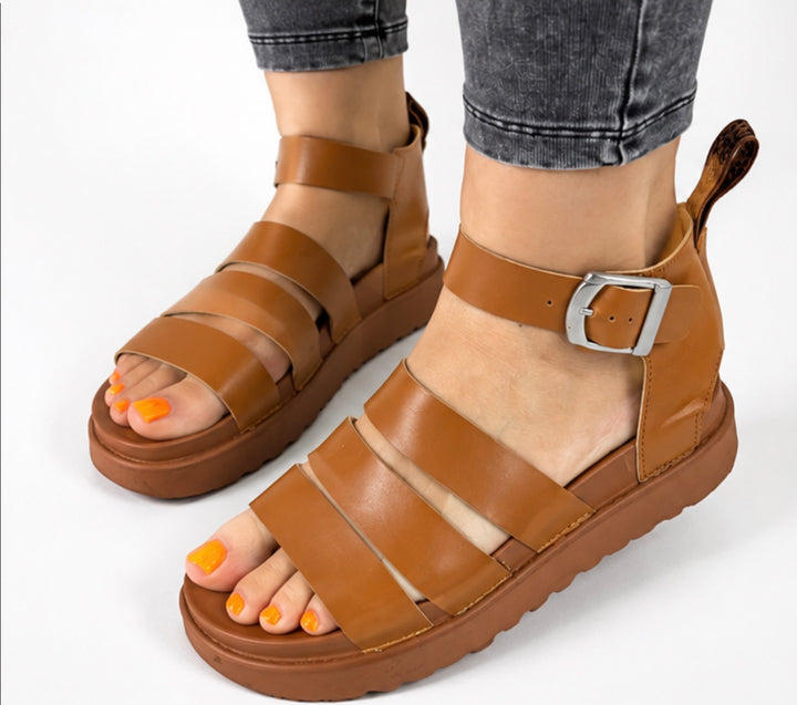 Camel tan chunky gladiator sandals with adjustable silver buckle and comfortable platform sole