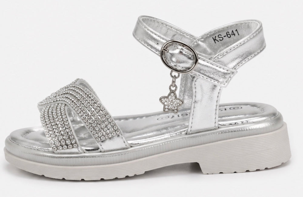 Girls silver diamante sandals with sparkling crossover straps, metallic silver finish and a dangling crystal clover charm