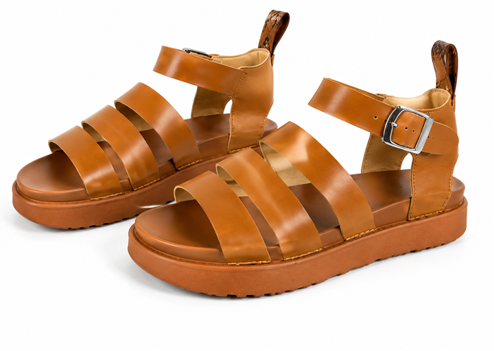 Camel tan chunky gladiator sandals with adjustable silver buckle and comfortable platform sole