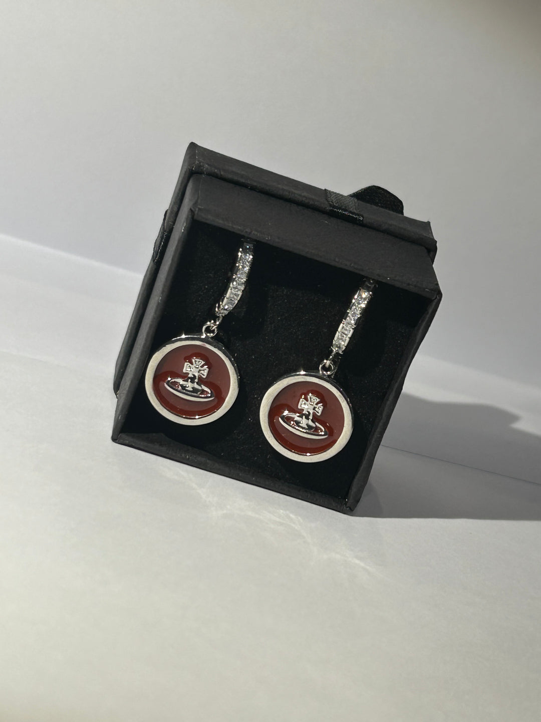 Burgundy planet dangle earrings