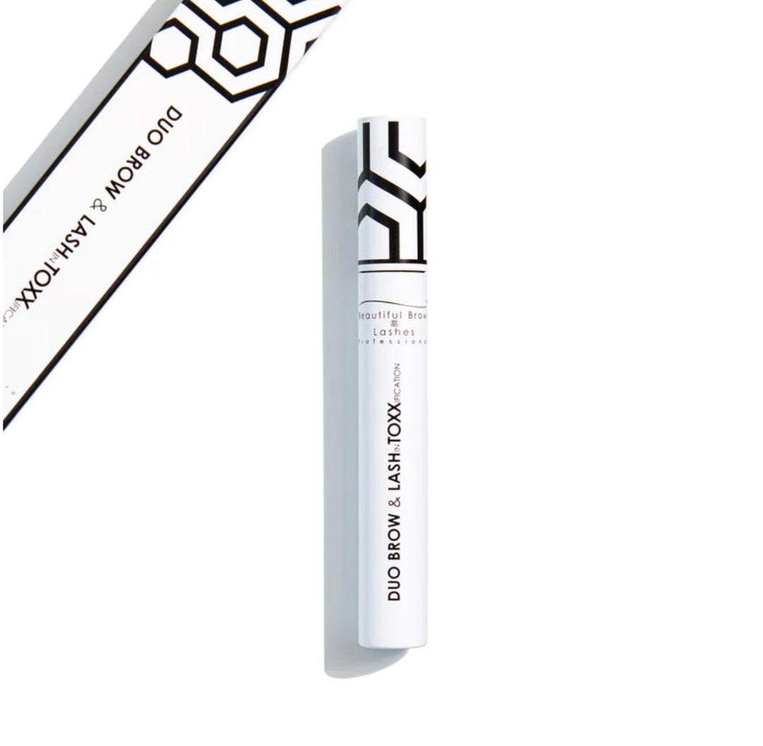 White cosmetic tube with black text stating duo brow &amp; lash toxx