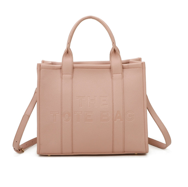 A pink tote bag with embossed ‘The Tote Bag’ text, structured design with top handles and detachable shoulder strap