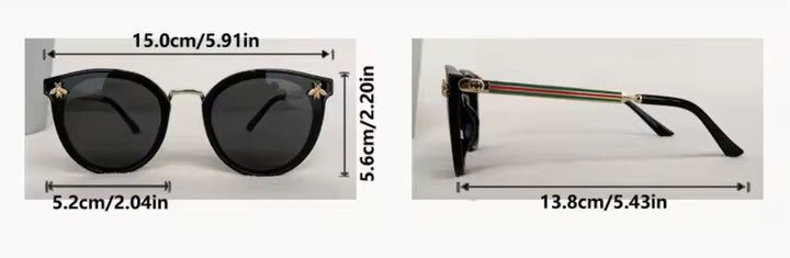 Black sunglasses with gold bee embellishment and green red stripe arms