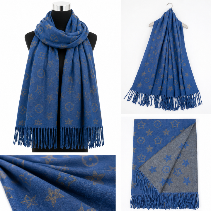 Blue reversible woven scarf with metallic-effect star and circular print, contrasting reverse and fringed edges.