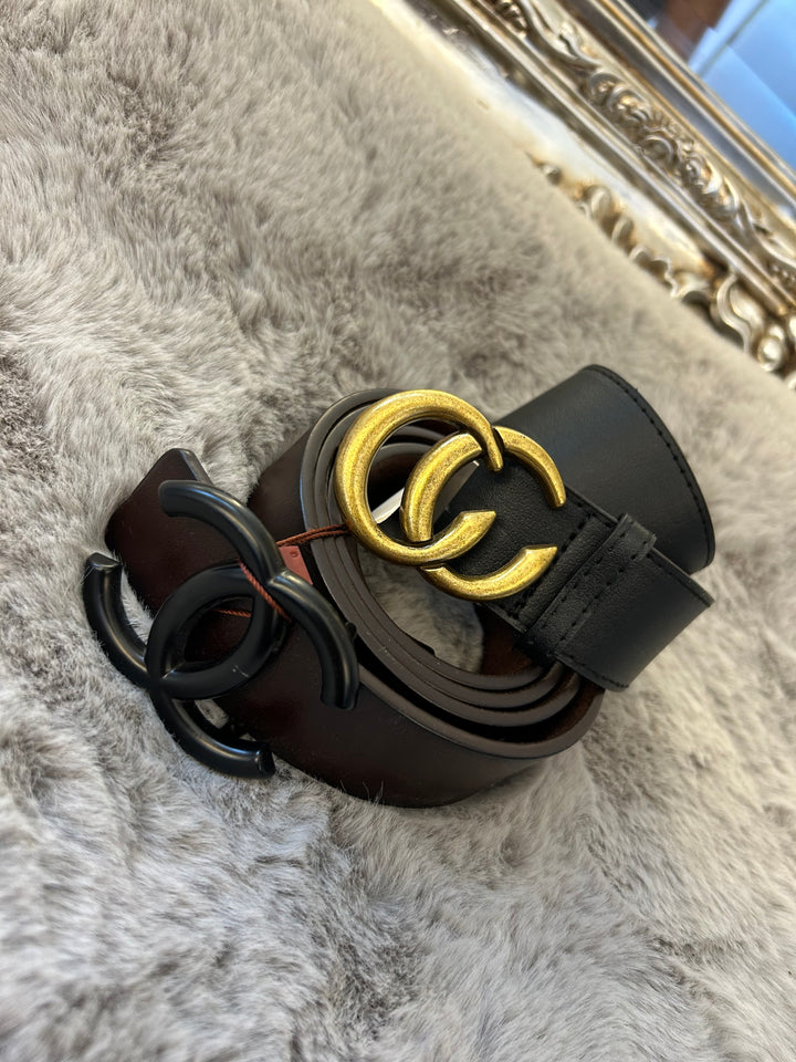 A belt with a gold-coloured buckle faux leather material